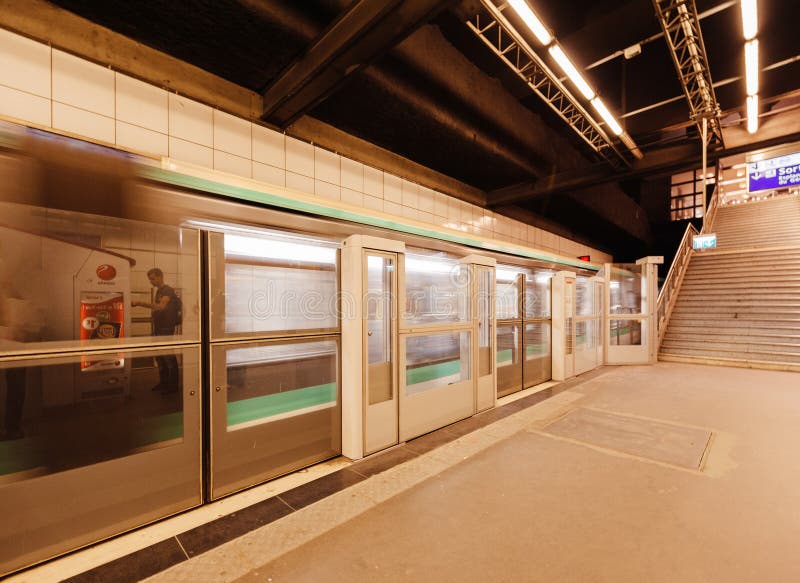 Parisian Metro Train Passing Behind Barrier at the Platform Editorial ...