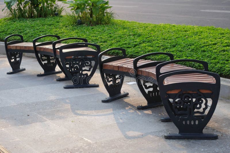 Park Chairs in Public Spaces on a Clean Pedestrian Path Stock Image
