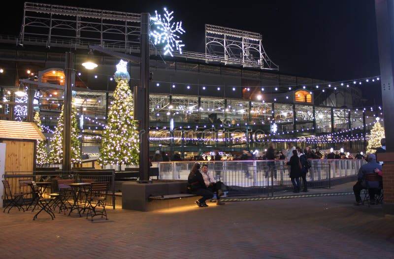 Night time visitors and ice skaters visit the new Park at Wrigley, Wrigley Field, Christmas Chicago. Night time visitors and ice skaters visit the new Park at Wrigley, Wrigley Field, Christmas Chicago.