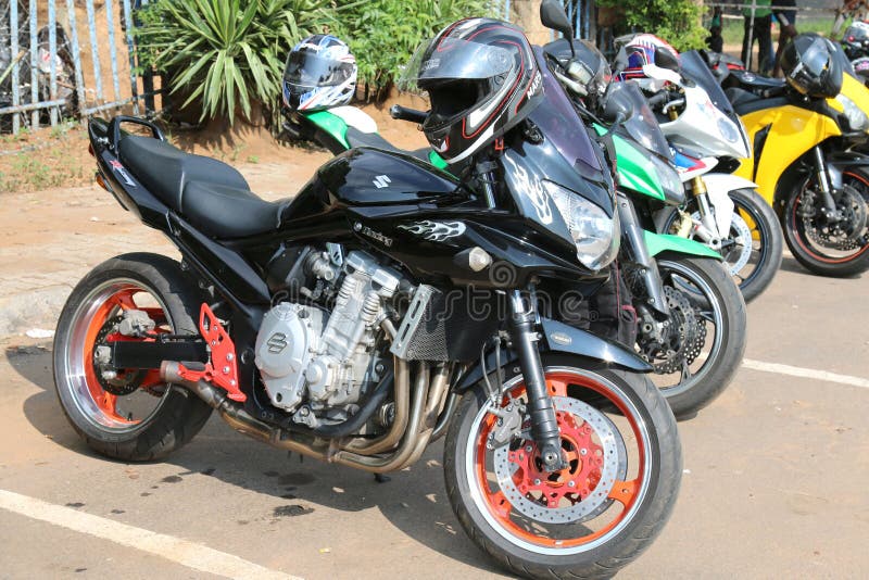 Parked motorbikes at Yearly Mass Ride with Black Suzuki Racing stock photo Parked motorbikes at Yearly Mass Ride with Black Suzuki Racing stock photo