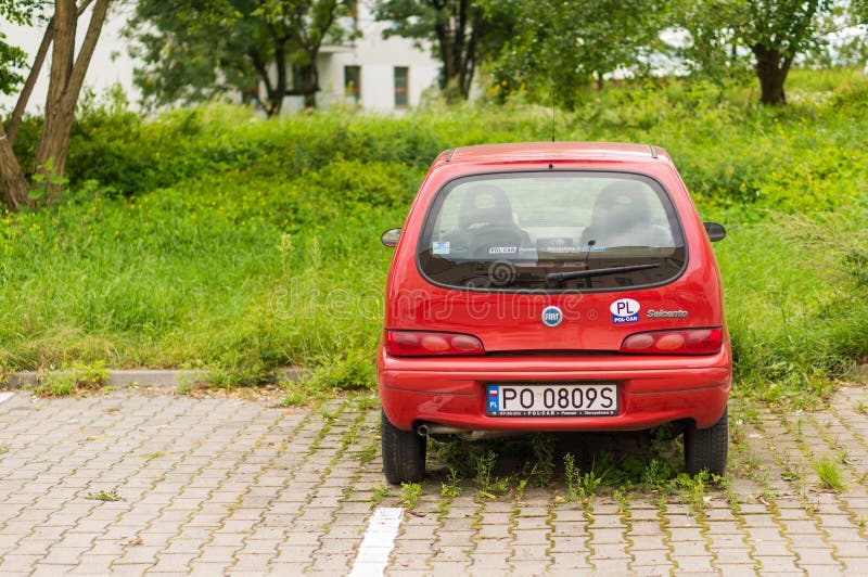 Parked Red Fiat Seicento stock photography Parked Red Fiat Seicento stock photography