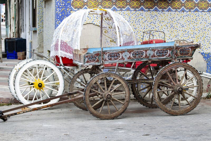 Parked Wooden Cart, Traditional rural transport, Historic objects, Antique wooden wagon wheels, Colorful wooden cart, Turkish traditional wagon. Parked Wooden Cart, Traditional rural transport, Historic objects, Antique wooden wagon wheels, Colorful wooden cart, Turkish traditional wagon
