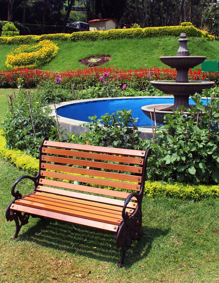 Park bench on meadow at kateri park near ooty, tamilnadu, india. Park bench on meadow at kateri park near ooty, tamilnadu, india