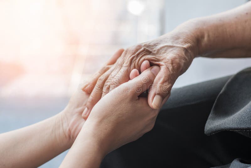 Parkinson disease patient, Alzheimer elderly senior, Arthritis person hand in support of nursing family caregiver care