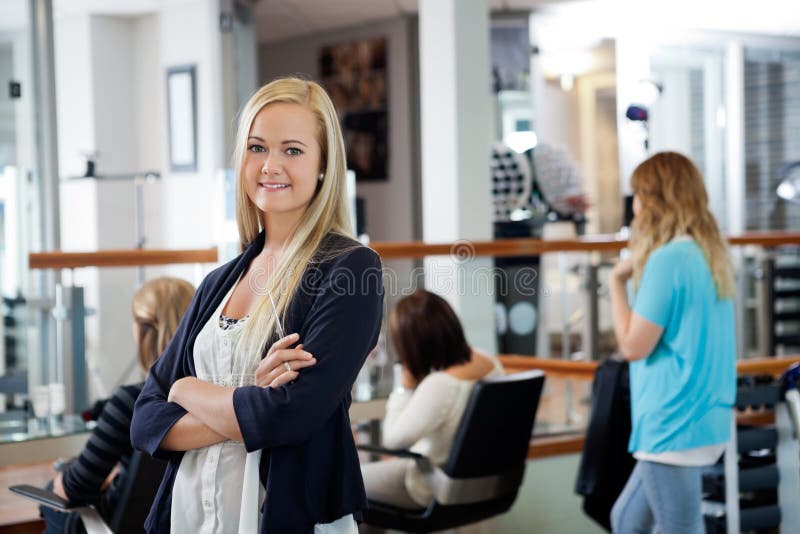 Parlor Owner Standing With Arms Crossed