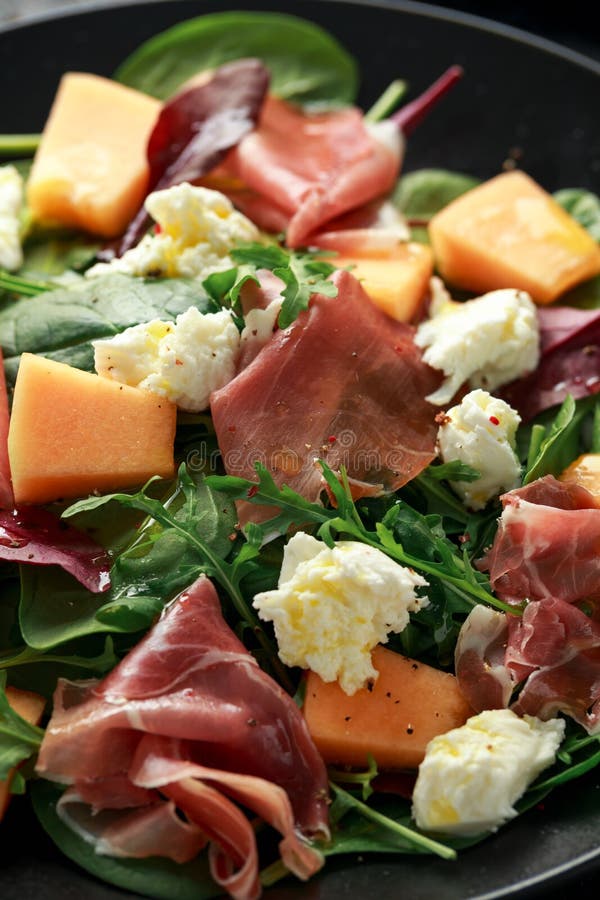 Parma Ham and Melon Salad with Mozzarella, Green Leaves Mix Stock Photo ...