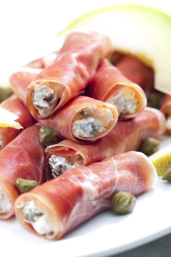 Parma Ham Rolls Filled with Cream Cheese, Galia Melon and Capers Stock