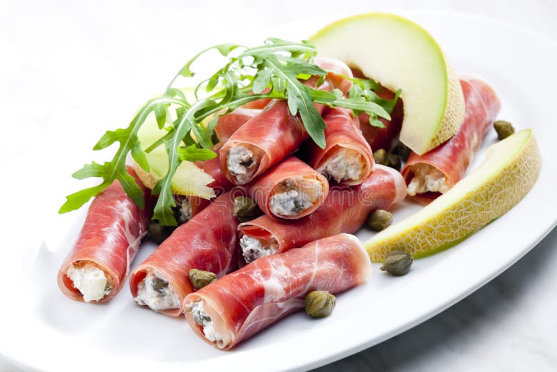 Parma Ham Rolls Filled with Cream Cheese, Galia Melon and Capers Stock