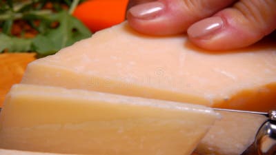 https://thumbs.dreamstime.com/b/parmesan-cheese-cut-thin-slices-background-green-arugula-160101803.jpg?w=400
