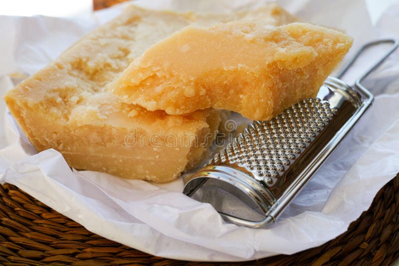 Parmesan Cheese and Parmesan Cheese Grater. Stock Image Image of