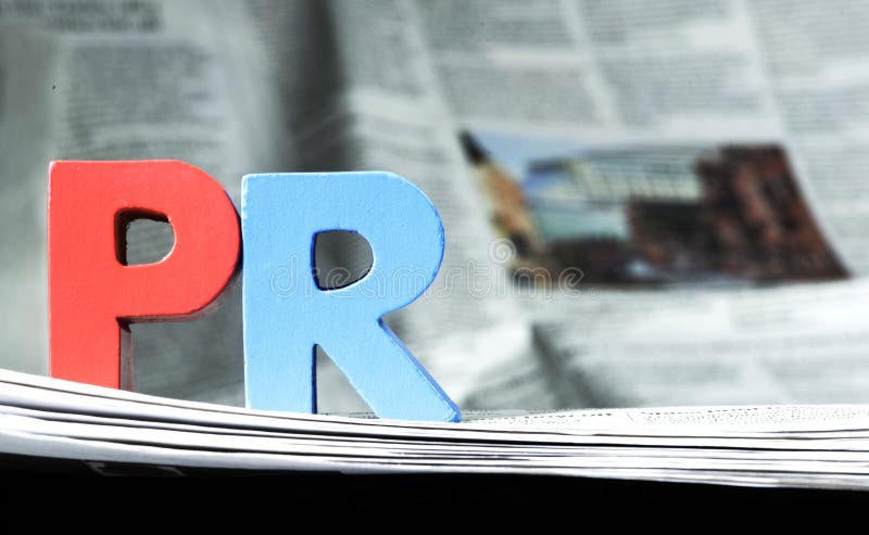 Parola PR sul giornale fotografia stock libera da diritti Parola PR sul giornale fotografia stock libera da diritti