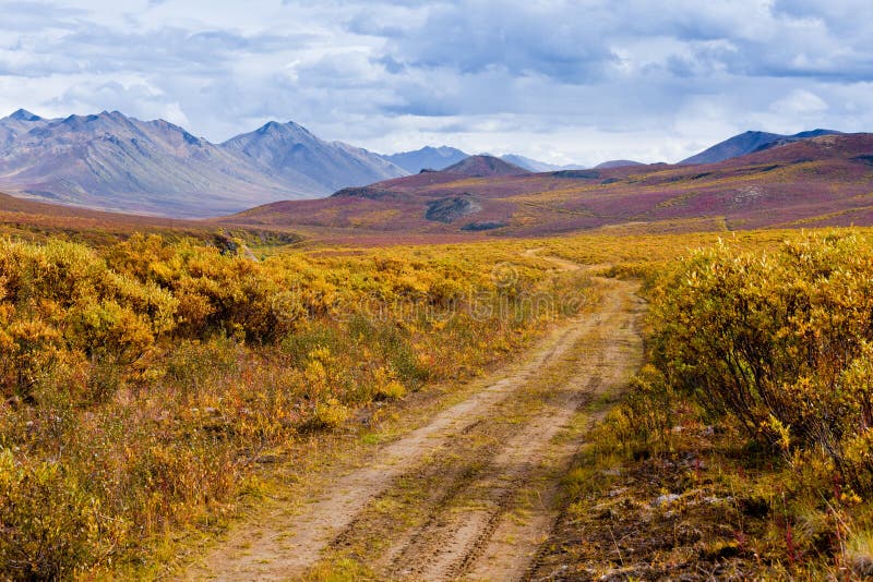Autumn fall colors in mountain tundra of Tombstone Territorial Park near Dempster Highway north of Dawson City, Yukon Territory, Canada. Autumn fall colors in mountain tundra of Tombstone Territorial Park near Dempster Highway north of Dawson City, Yukon Territory, Canada