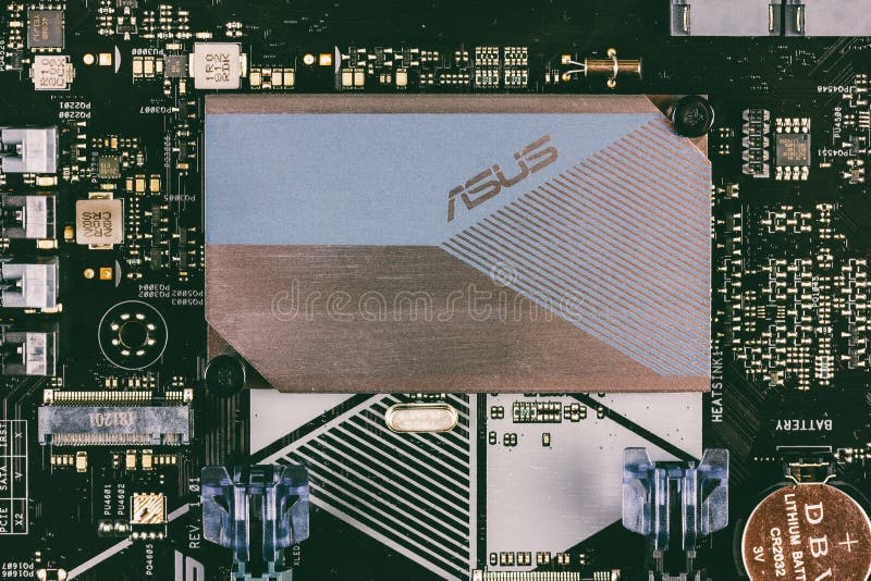 Part of ASUS motherboard with aluminum radiator chipset top view close-up royalty free stock photo Part of ASUS motherboard with aluminum radiator chipset top view close-up royalty free stock photo
