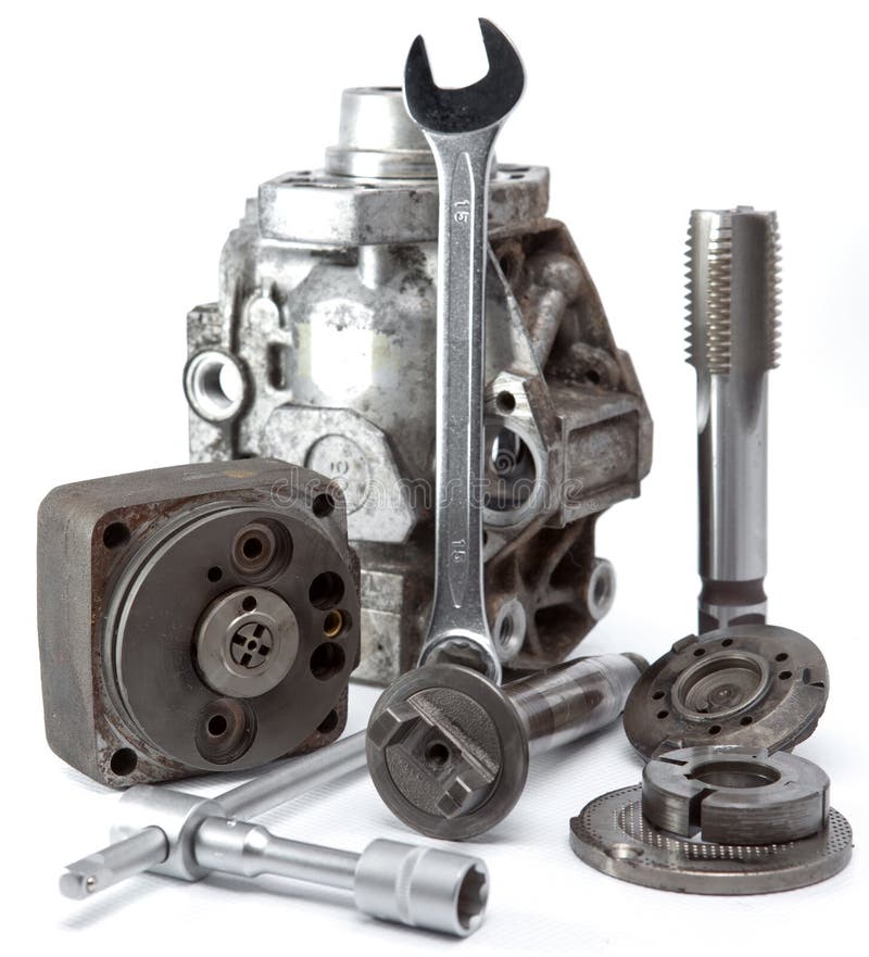 The Part Of Car High Pressure Pump And The Tool For Repair On A White