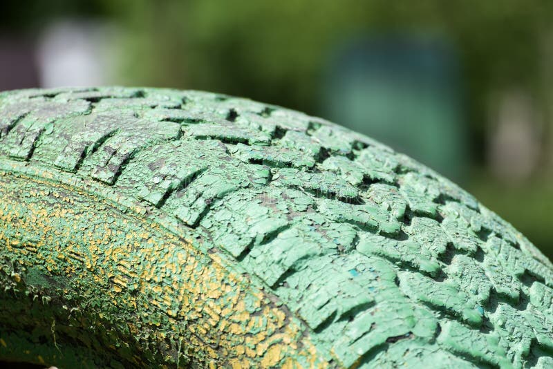 Part of the Car Tire with Peeling Green Paint Stock Photo Image of