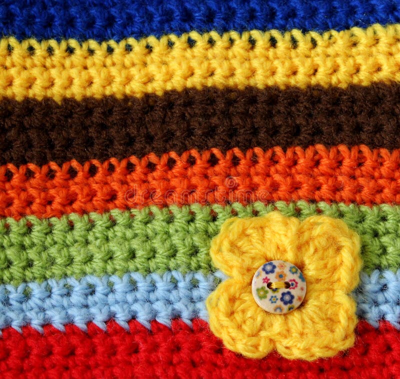 Part of colorful knitted wool with knitted flower