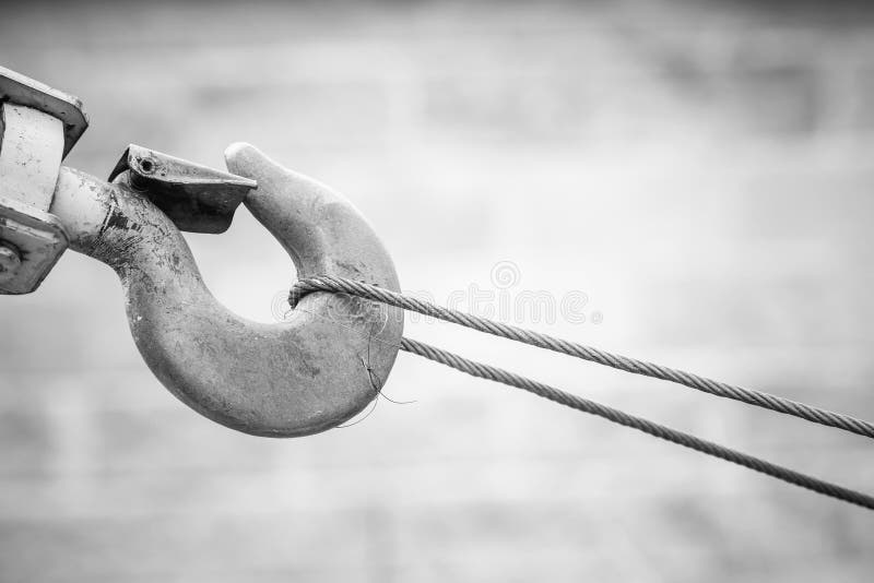 Part of crane on the background of heavy industrial machinery