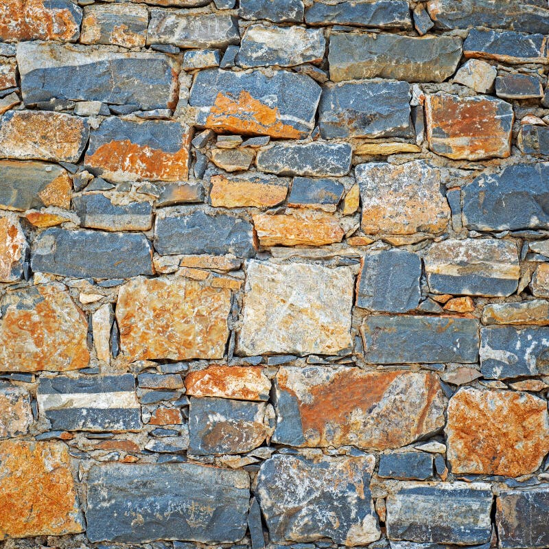 Part of grunge colorful stone blocks wall. stock image