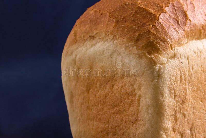Part of a Loaf of White Bread on a Blue Background Stock Image Image