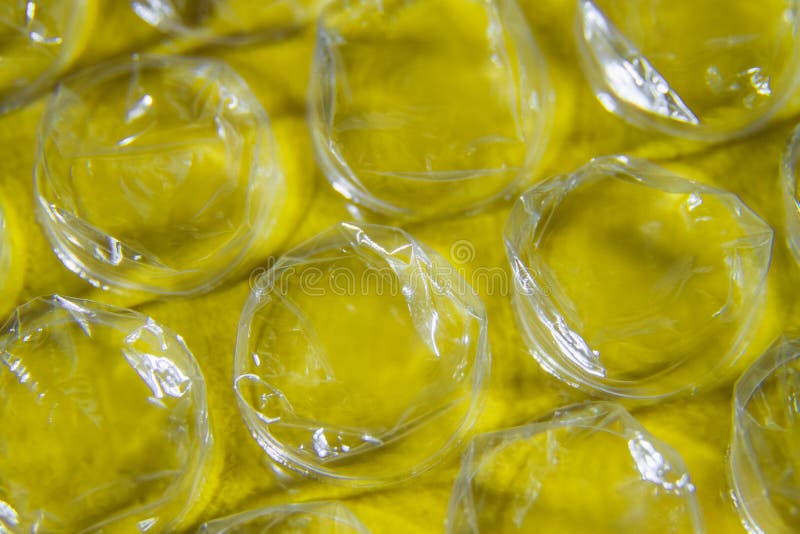 Part of the Packaging Bubble Wrap on a Yellow Background Stock Photo