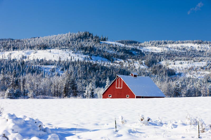 Part of red barn in winter.