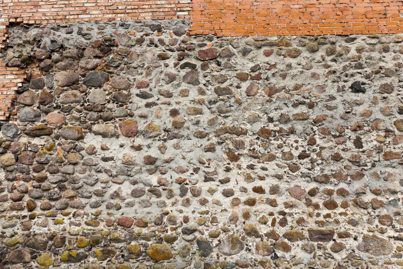 Combined Wall of an Ancient Castle, Part of a Medieval Castle Wall Made of Stone Stock Photo