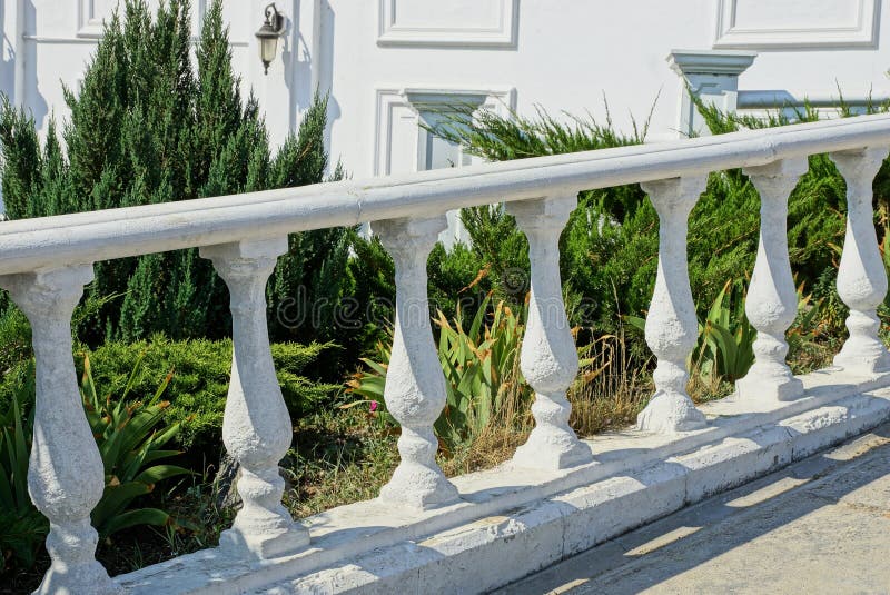 White Concrete Decorative Fence Near the Green Vegetation Stock Image ...