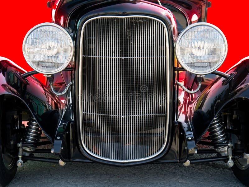 Close up front view of a black hot rod automobile. Close up front view of a black hot rod automobile.