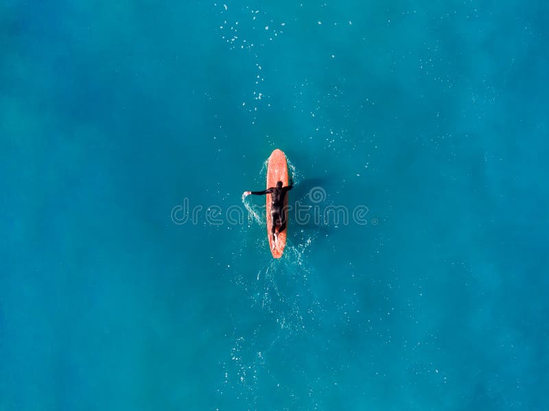 Surfer wave in ocean, top view aerial photo, tropical water. Surfer wave in ocean, top view aerial photo, tropical water