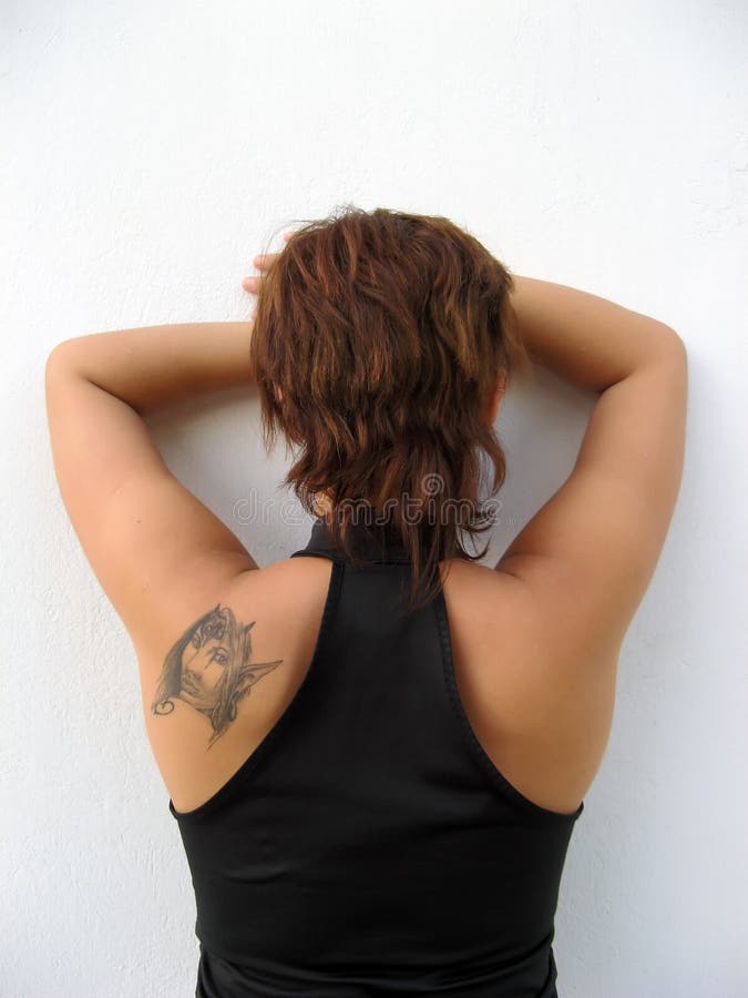 Costas de uma mulher imagem de stock