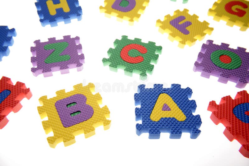 Pezzi del puzzle dell'alfabeto immagini stock libere da diritti