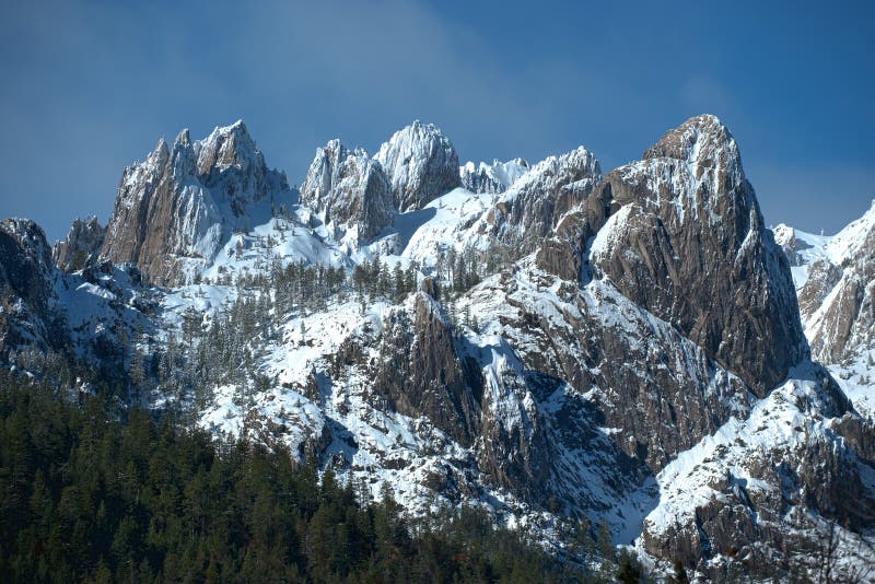 Winter wonderland of snow-capped granite peaks, Castle Crags State Park, California. Winter wonderland of snow-capped granite peaks, Castle Crags State Park, California.