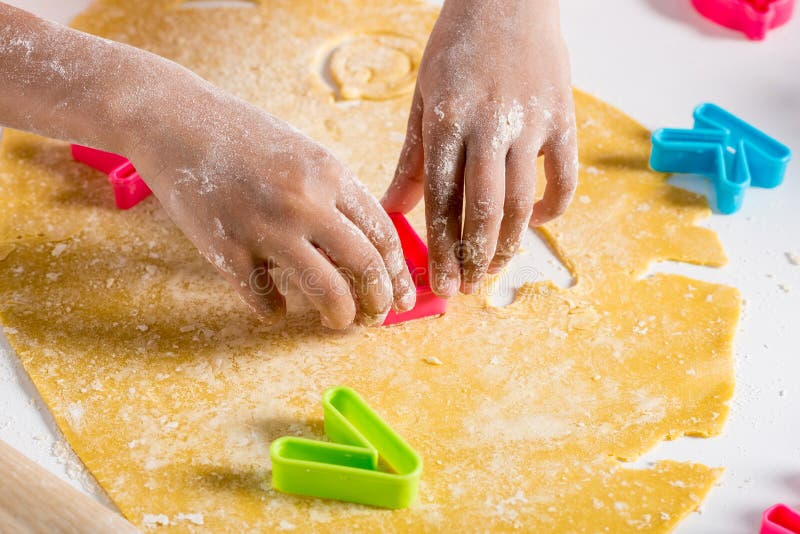 partial view of african american kid making cookies