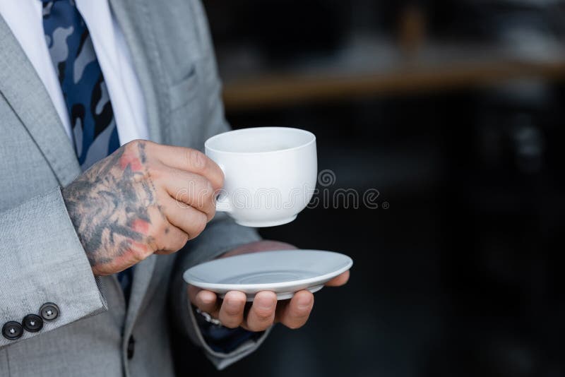 cropped shot of young businessman with tattoos standing with crossed arms  in office Stock Photo  Alamy