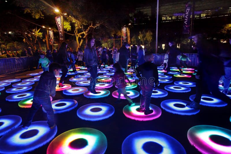 Participants interact with Vivid Sydney The Pool interactive cir