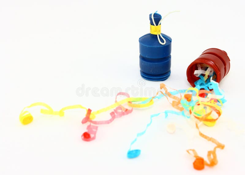 Two plastic party poppers with streamers on a white background. Two plastic party poppers with streamers on a white background.