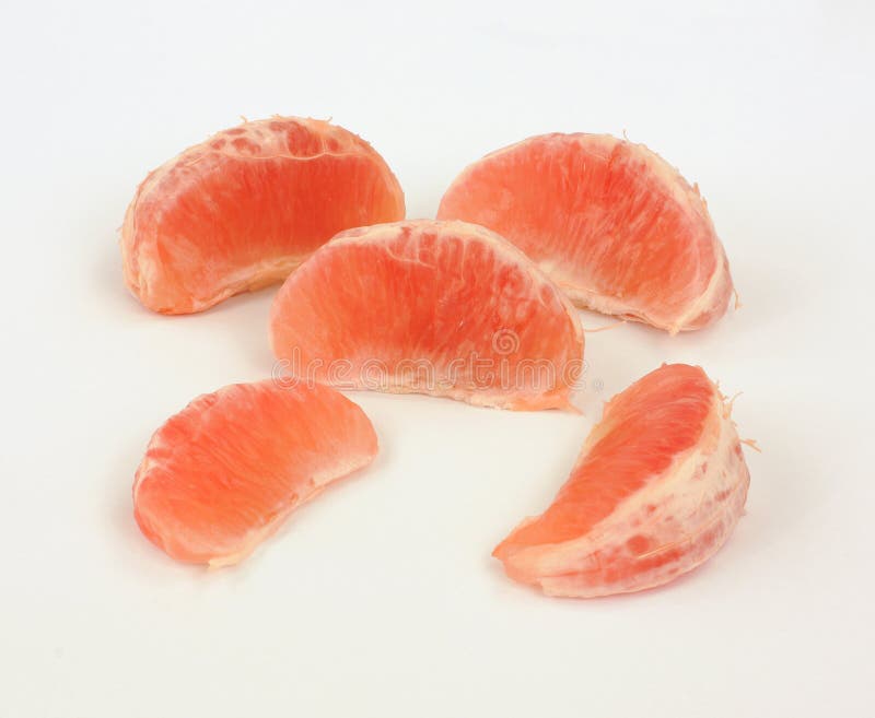 Parts juteuses de pamplemousse images stock