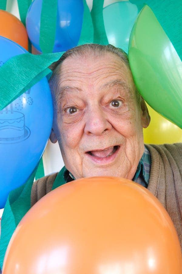 Party balloons & elderly man