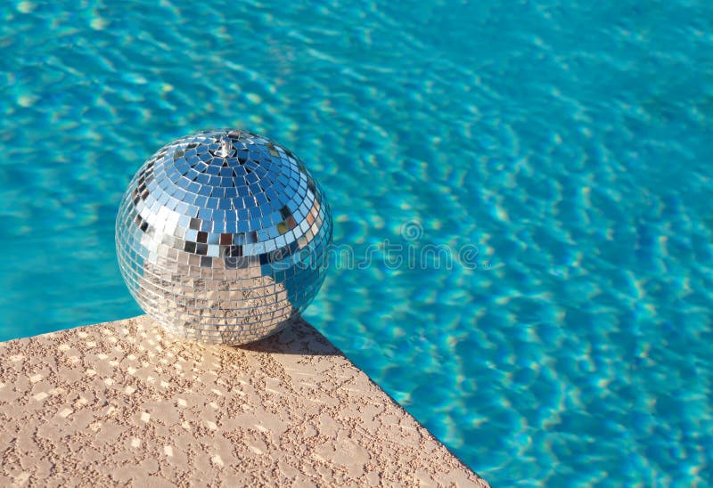 Party! Disco Ball beside resort swimming pool