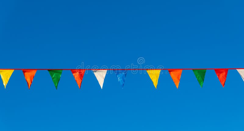 Party Flags Colorful Celebrate Abstract on Blue Sky Background Stock