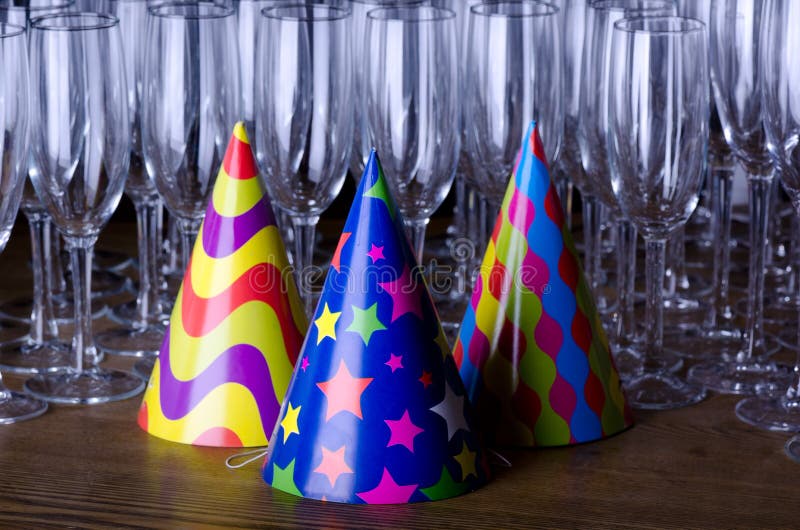 Party hats and glass flutes royalty free stock photos