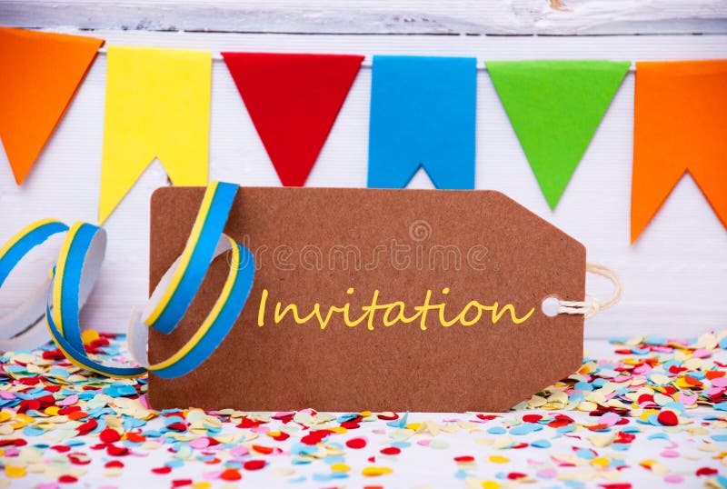 Party Label With Streamer, Text Invitation. Brown Label With English Text Invitation. Party Decoration Like Streamer And Confetti. White Wooden Background royalty free stock image Party Label With Streamer, Text Invitation. Brown Label With English Text Invitation. Party Decoration Like Streamer And Confetti. White Wooden Background royalty free stock image