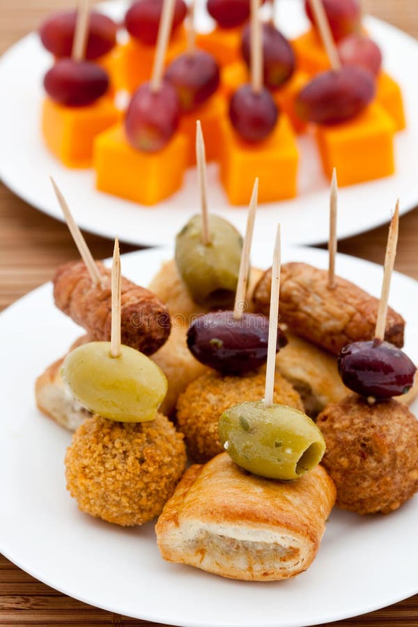 Party snacks. Sausage rolls, olives & cheese