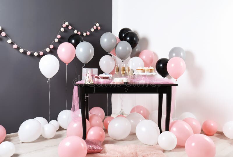Party treats and items on table in room stock images Party treats and items on table in room stock images