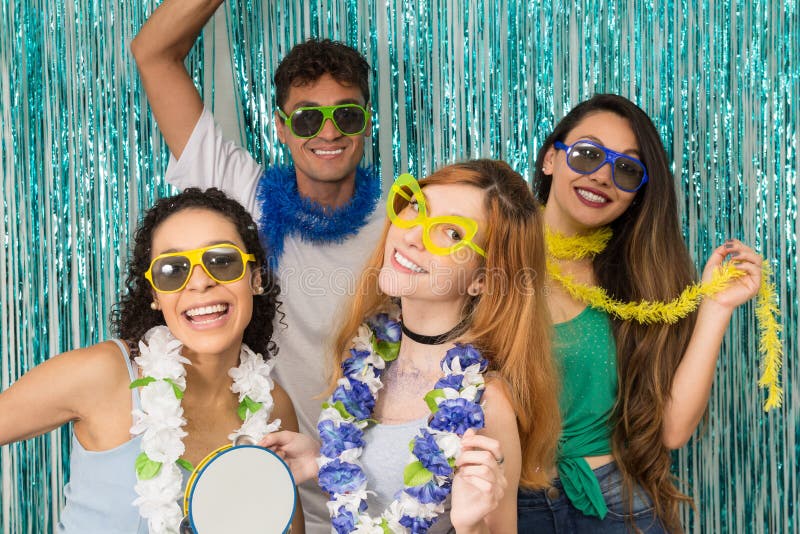 Partygoers are celebrating Carnival in Brazil. People in colorful and happy sunglasses.. stock photo Partygoers are celebrating Carnival in Brazil. People in colorful and happy sunglasses.. stock photo