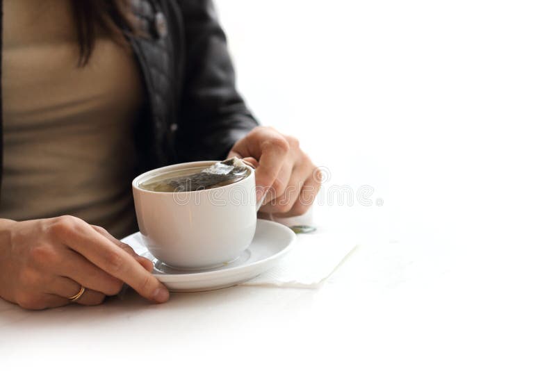 Woman brew tea from teabag on white. Woman brew tea from teabag on white