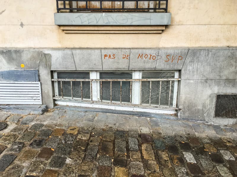 Pas De Motos Svp Sign On Window Of French Apartment Building
