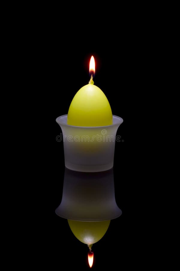 Paschal candle in a glass candlestick