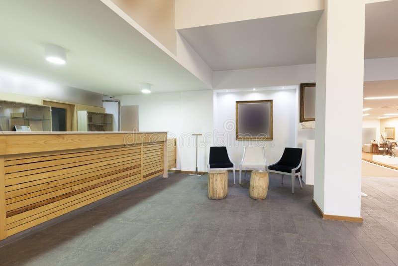 Spacious hotel lobby with reception desk. Spacious hotel lobby with reception desk.