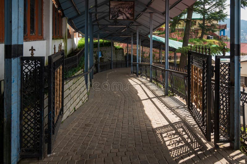 Covered walkway at Shimla Old Railway station. Shimla railway station is a small railway station in Shimla in the Indian state of Himachal Pradesh. The station is the terminus of the UNESCO World Heritage Site Kalka–Shimla Railway. Shimla railway station is located at an altitude of 2,075 metres (6,808 ft) above mean sea level. It was allotted the railway code of SML under the jurisdiction of Ambala railway division. The 762 mm (2 ft 6 in)-wide narrow-gauge Kalka-Shimla Railway was constructed by Delhi–Ambala–Kalka Railway Company and opened for traffic in 1903. Code division stock images, royalty-free photos and pictures